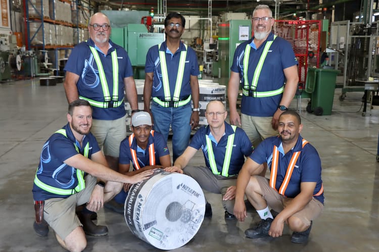 Netafim South Africa team members with the first market-ready roll of Streamline™ X that was produced in the Cape Town manufacturing plant. At the back from the left is James Everts, Suren Moonasar and Buks van Zyl. In the front from the left is Alfie Delport, Edward Appolis, Joe le Roux and Gerard Hyster.
