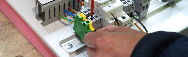 hand working on electrical wiring